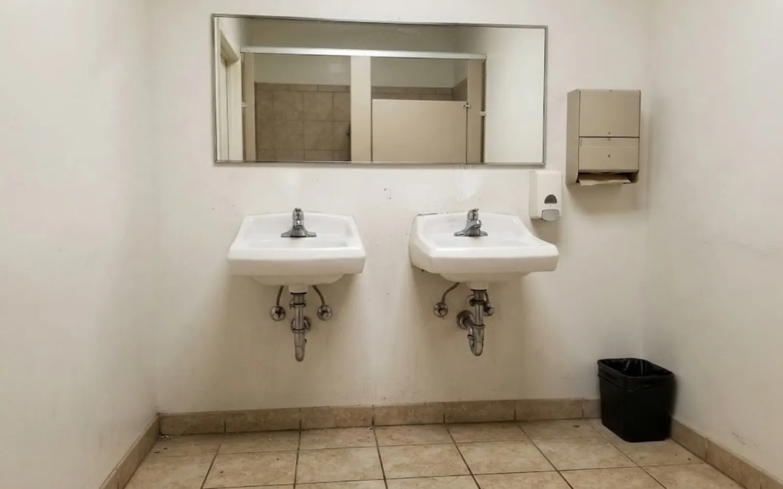 commercial restroom sinks and plumbing in a small business