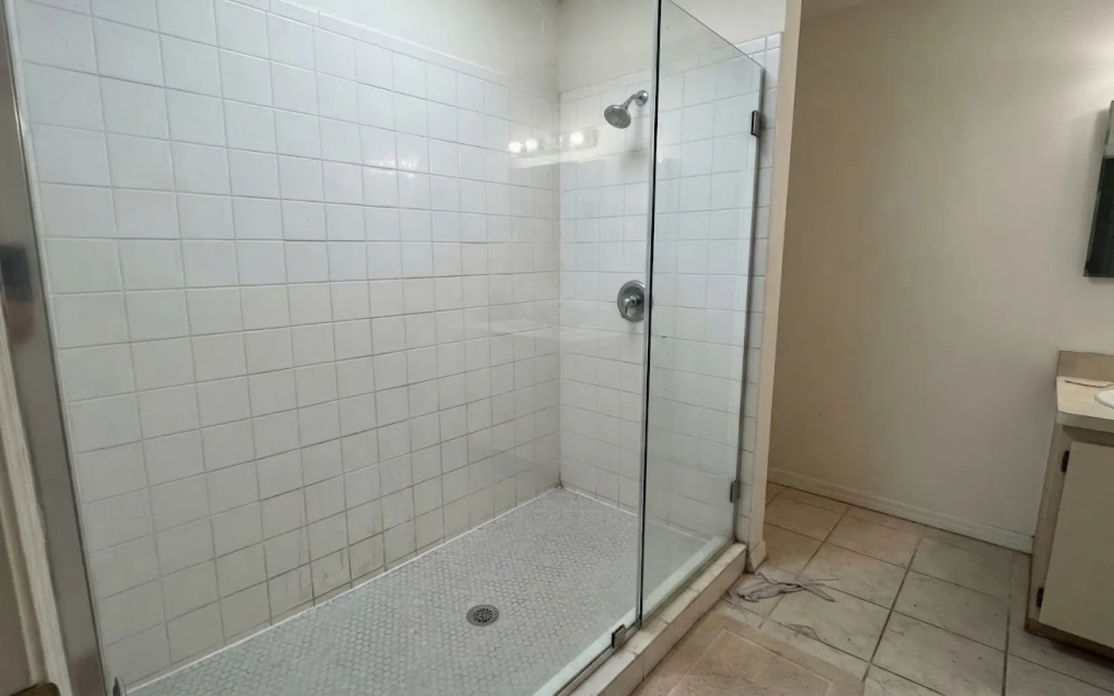 newly installed walk-in shower with a pressure balancing valve